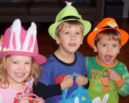 KIDS DOING AN EASTER EGG HUNT TRADITION